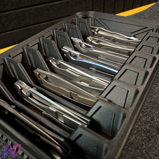 Matte black knife organizer on black surface