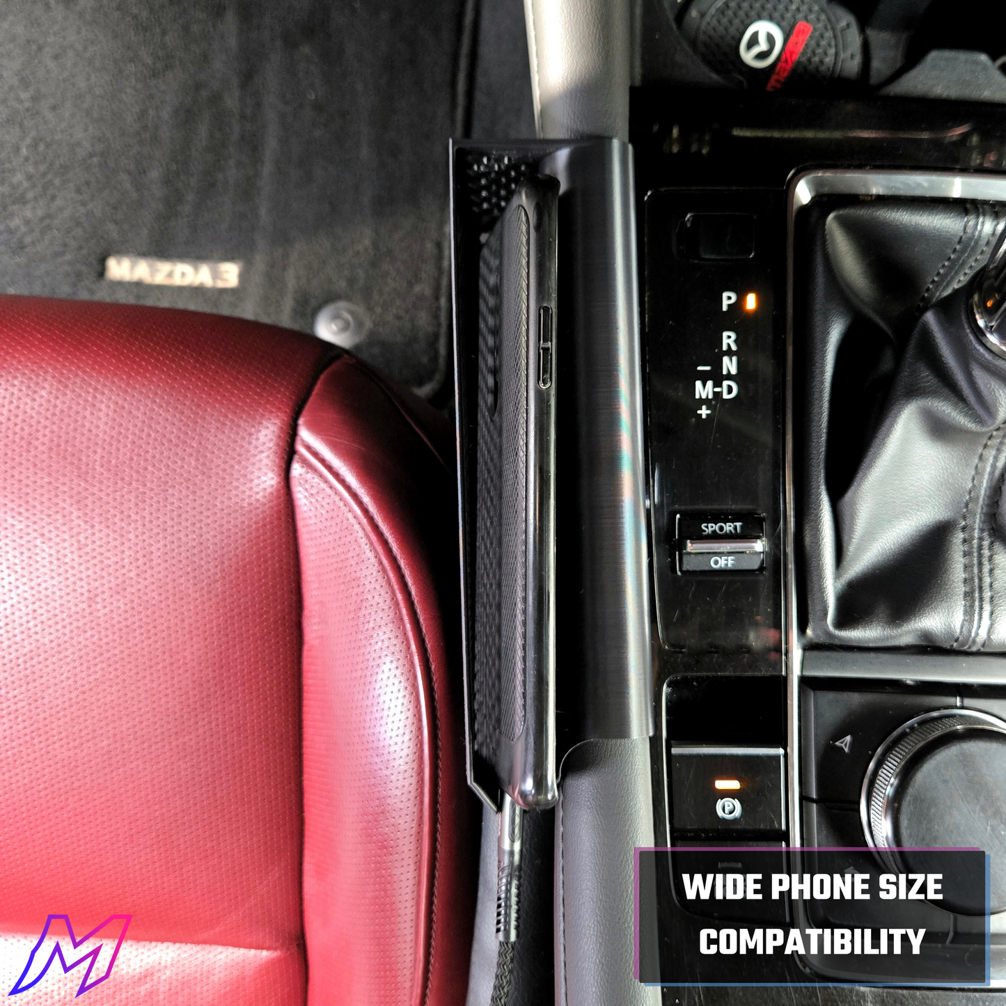 MATERIUM Mazda3 phone holder installed driver side showing charging cord slot for cable management