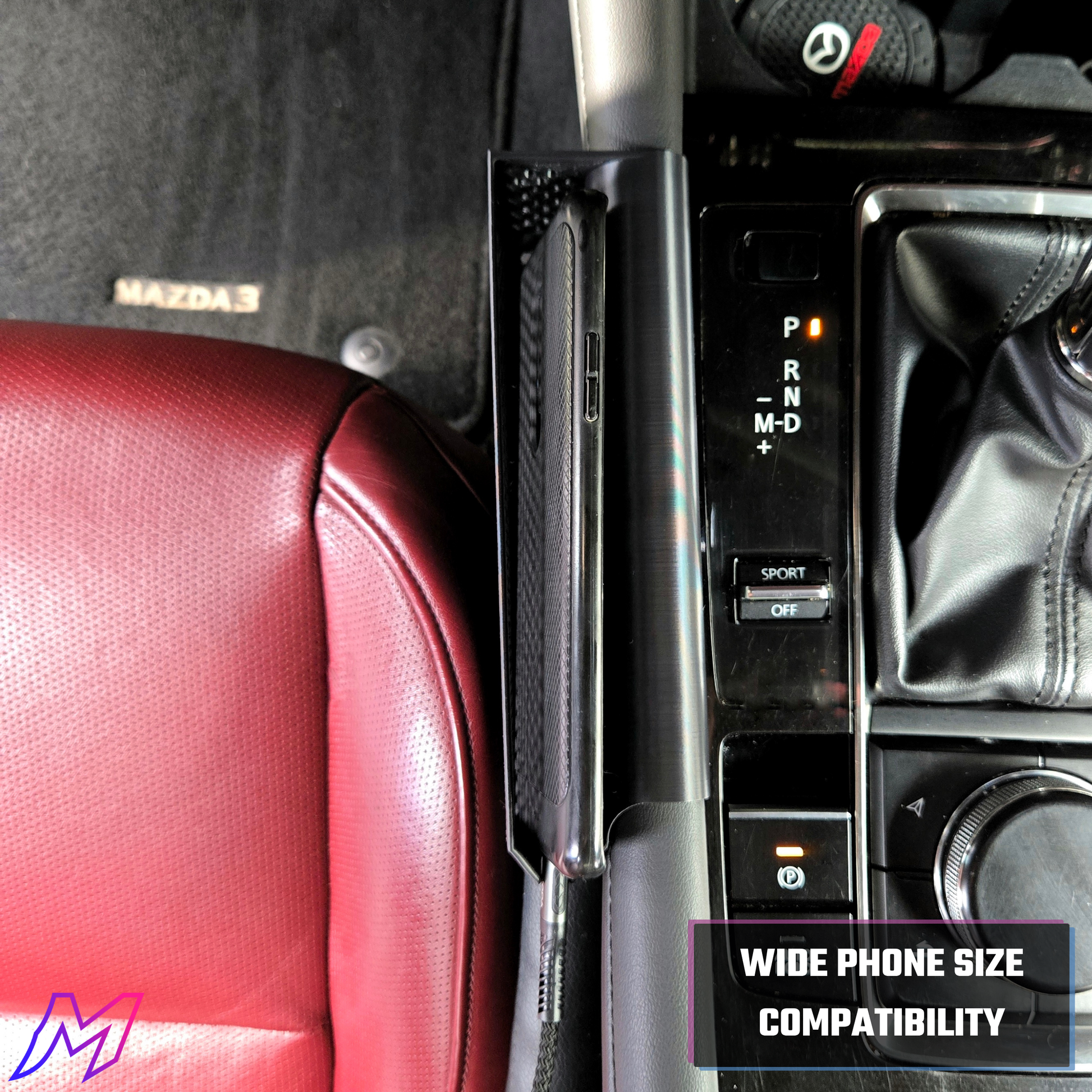 MATERIUM Mazda3 phone holder installed driver side showing charging cord slot for cable management