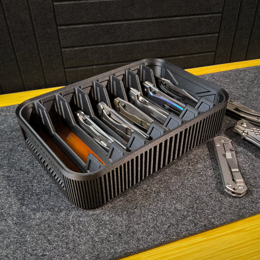 Matte black knife organizer on black surface