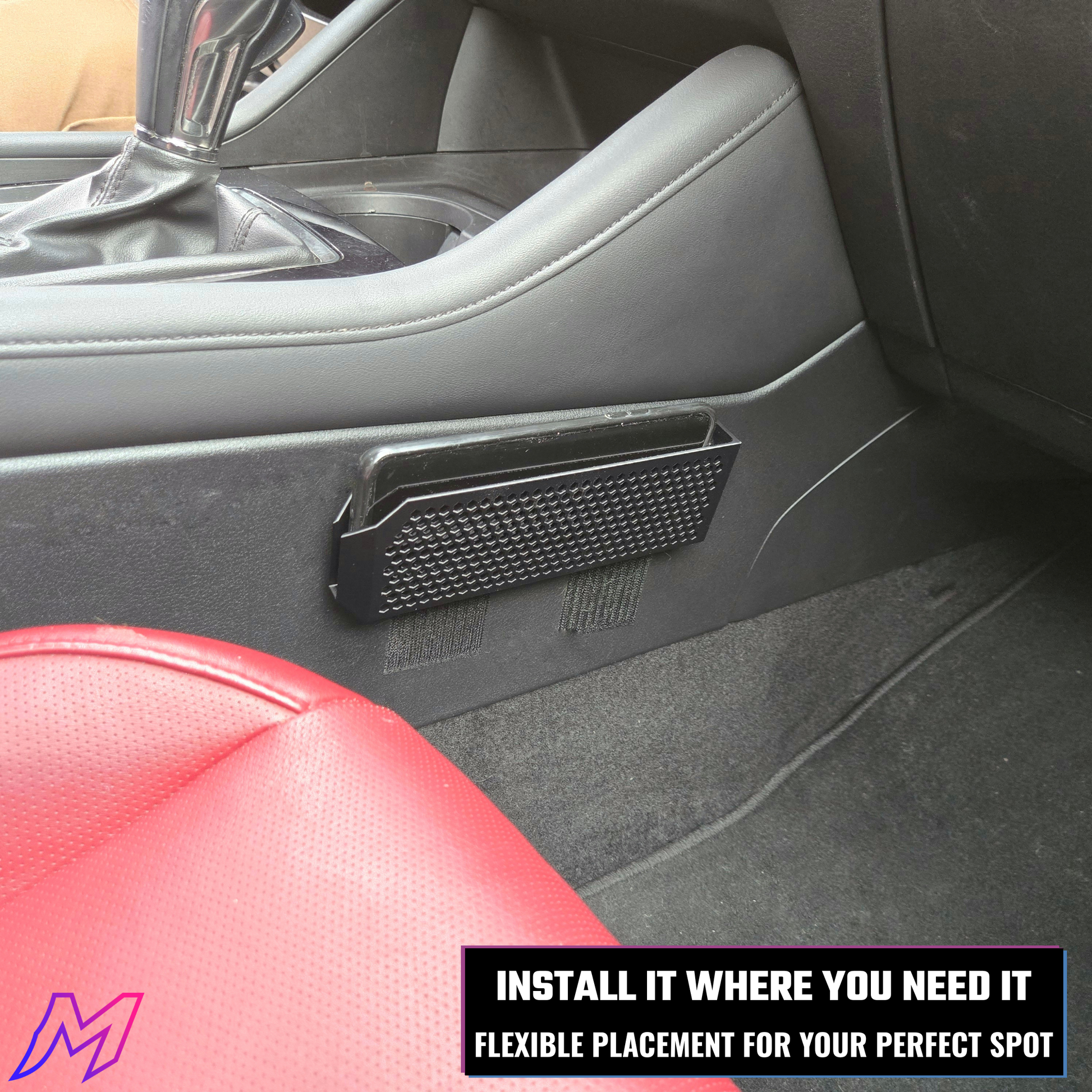 Car interior with a black organizer attached to the door panel, promoting flexible placement.
