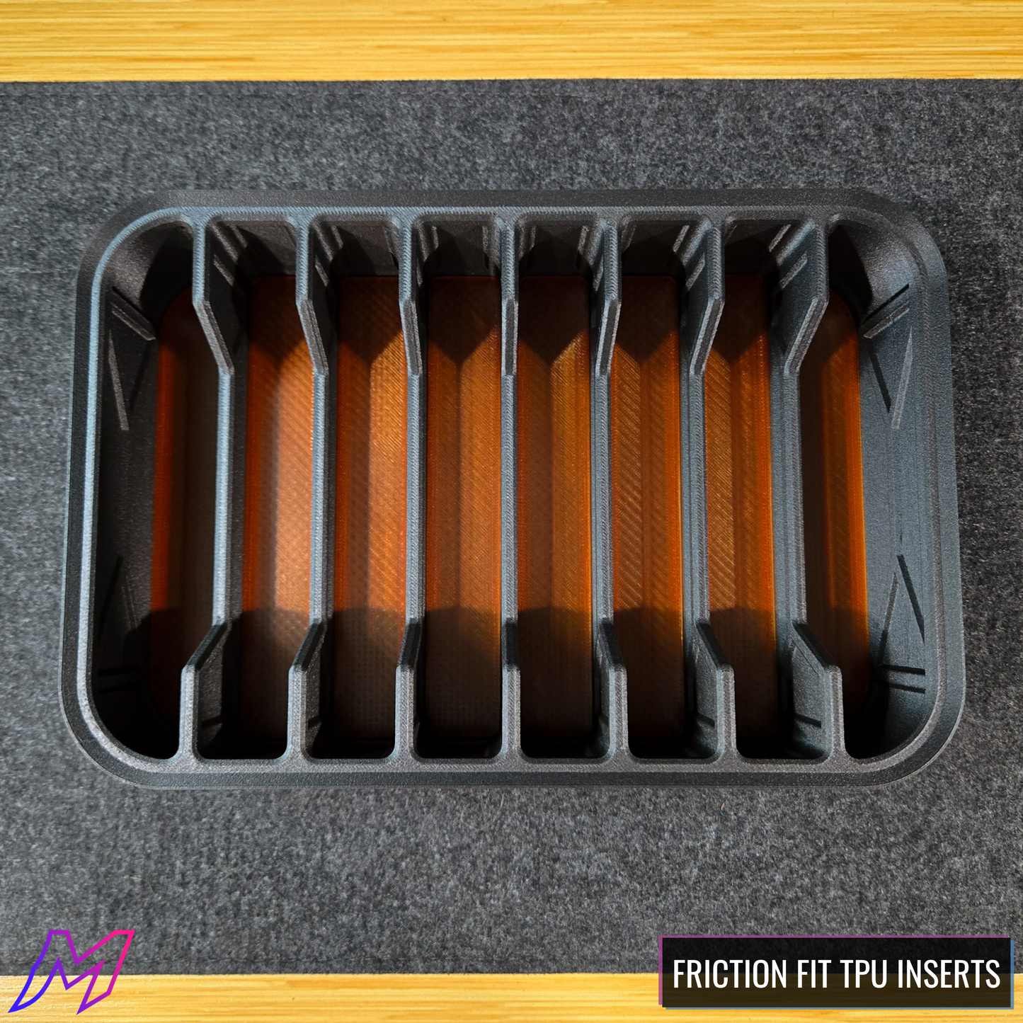 MATERIUM Vanguard Array top-down interior showing 8 amber friction-fit TPU knife slots