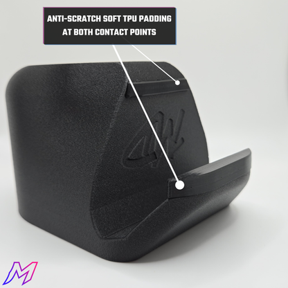Black phone stand with anti-scratch soft TPU padding on a gray background