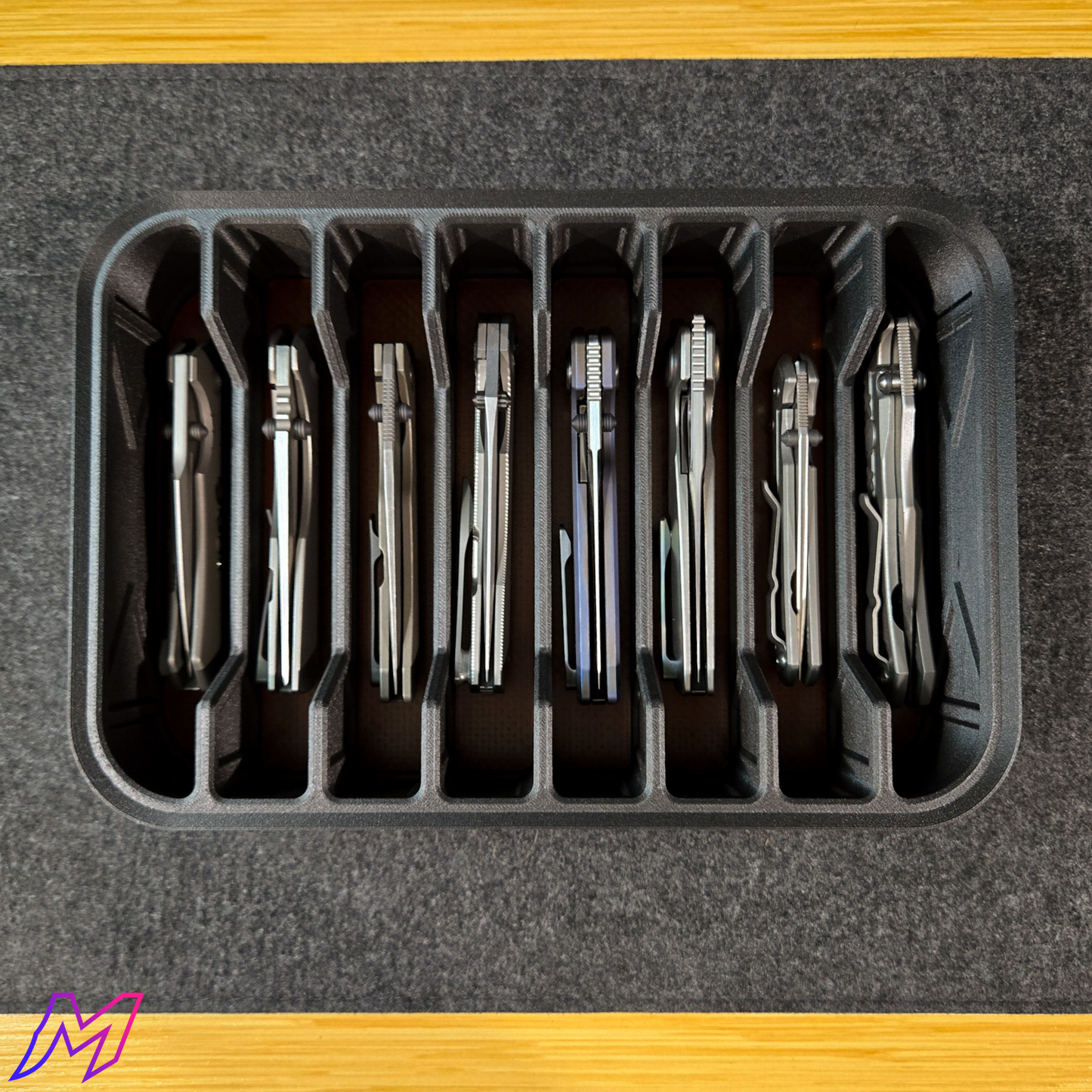 MATERIUM Vanguard Array loaded with 8 titanium folding knives, storage for 8 full-size folders