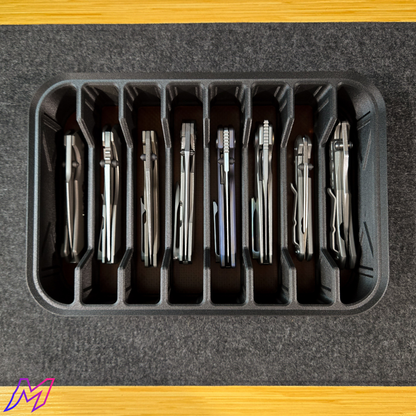 MATERIUM Vanguard Array loaded with 8 titanium folding knives, storage for 8 full-size folders