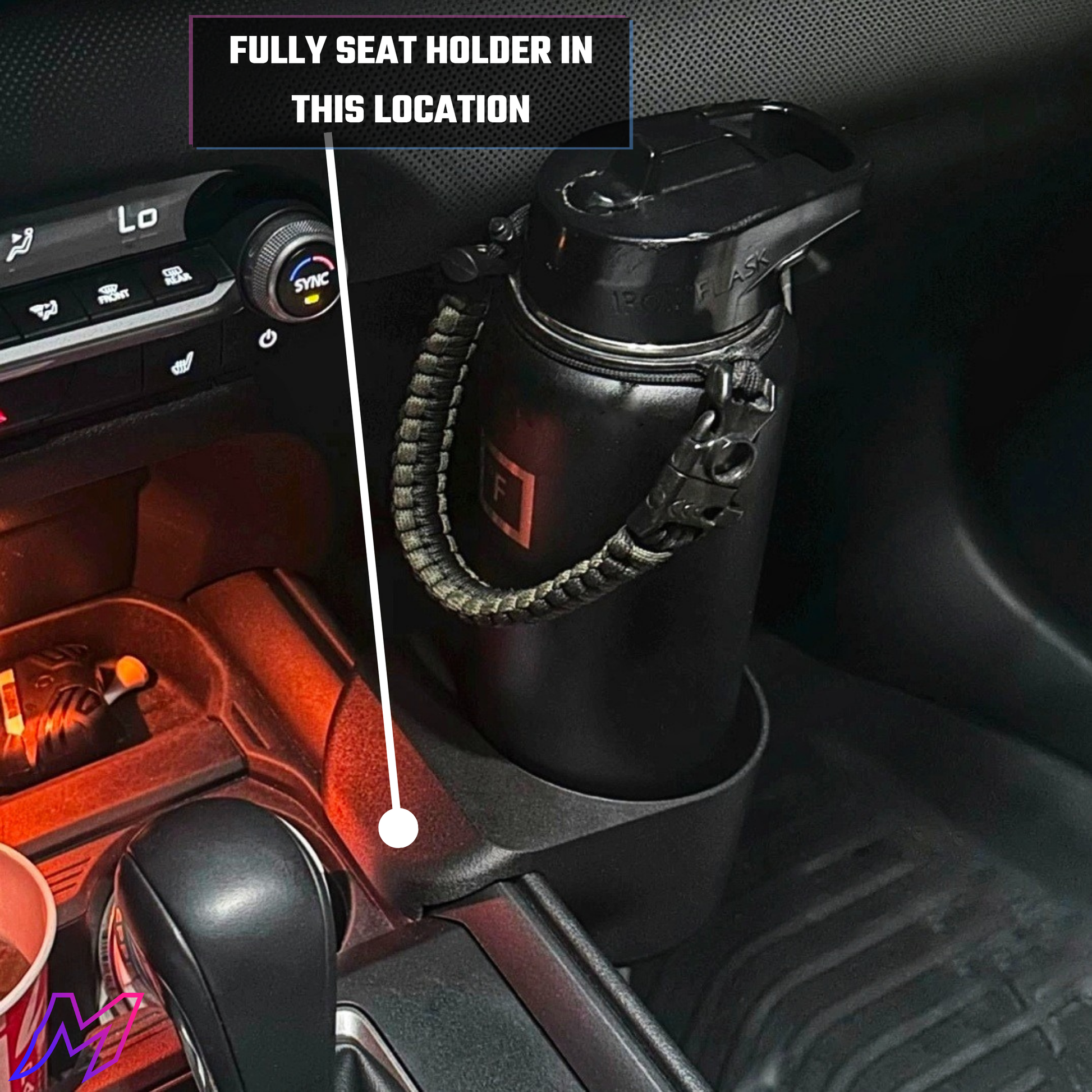 Black cup holder in a car with text indicating it is fully seated.