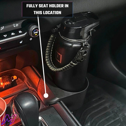 Black cup holder in a car with text indicating it is fully seated.