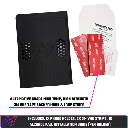 MATERIUM universal phone holder flat lay with contents — holder, two 3M VHB hook and loop strips, alcohol prep pad, installation guide — annotation points to automotive grade strips