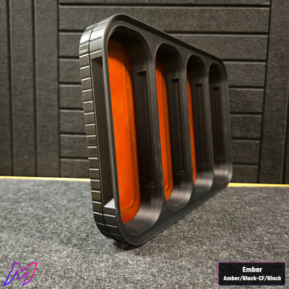 MATERIUM Vanguard Catch Ember colorway side profile showing ribbed black exterior and amber resin interior glow