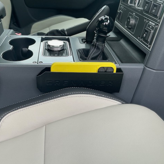 MATERIUM Ineos Grenadier slim phone holder installed in center console.