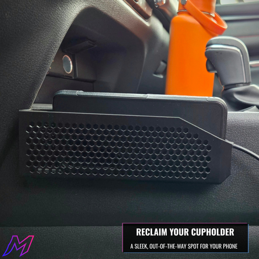 Car cupholder organizer with honeycomb pattern on a car dashboard.