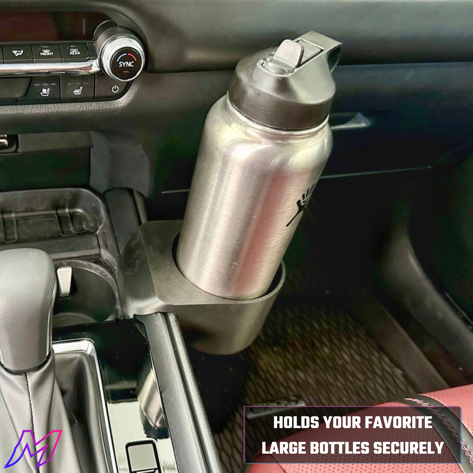 Silver water bottle holder securely holding a water bottle inside a car.