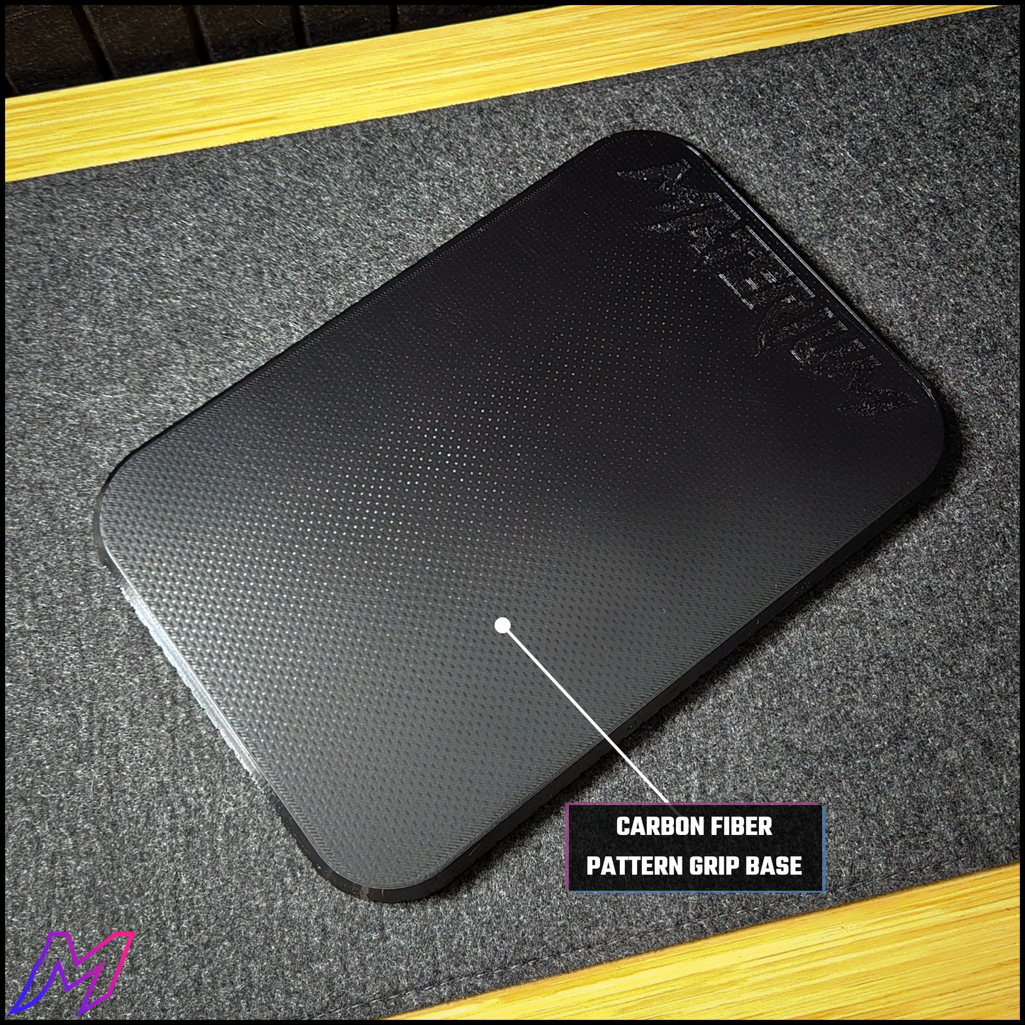 MATERIUM Vanguard Catch carbon fiber pattern grip base close-up detail