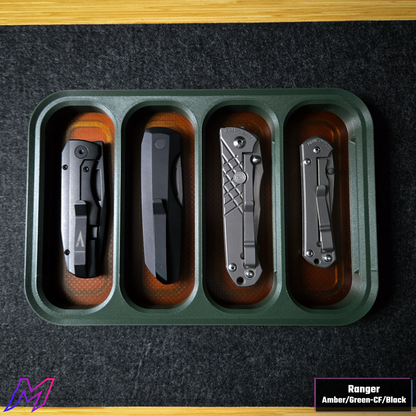 MATERIUM Vanguard Catch Ranger colorway loaded with 3 folding knives, green carbon fiber frame with amber resin base