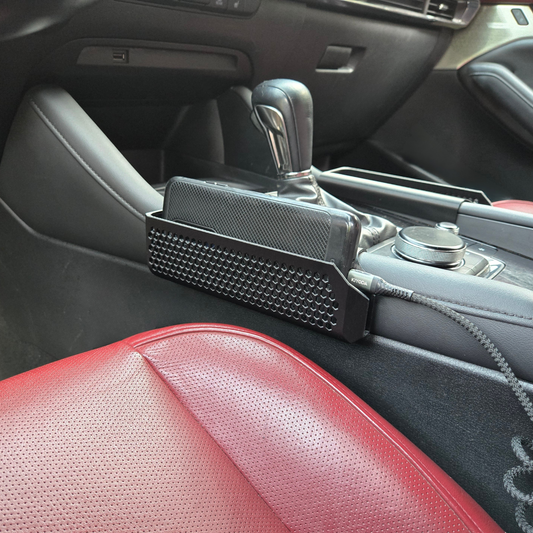 MATERIUM phone holder installed in Mazda3 Gen 4 center console, mounted next to the shifter