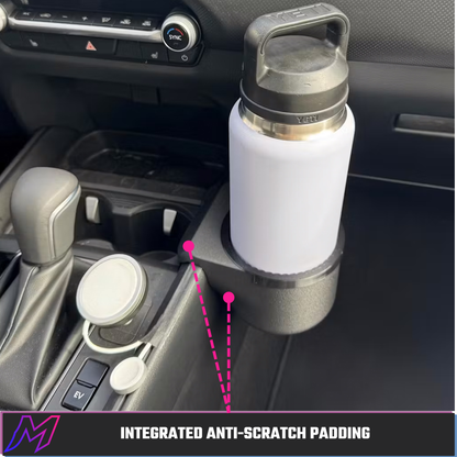 MATERIUM Mazda CX-50 bottle holder with integrated anti-scratch padding, protects console trim and shifter surround from contact